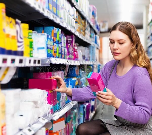 woman-holding-personal-hygiene-items-supermarket-portrait-213503211